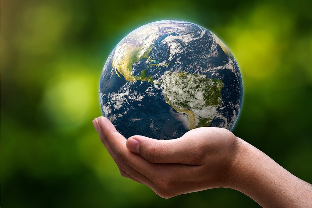 globe blue on hands in green blurred nature background, earth in adult hands , earth day, world day, energy saving concept, Elements of this image furnished by NASA.